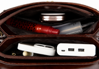 Open brown leather zippered pouch showing organized compartments with travel items including a red spray bottle, compact, tube, white power bank, and white multi-port charger.
